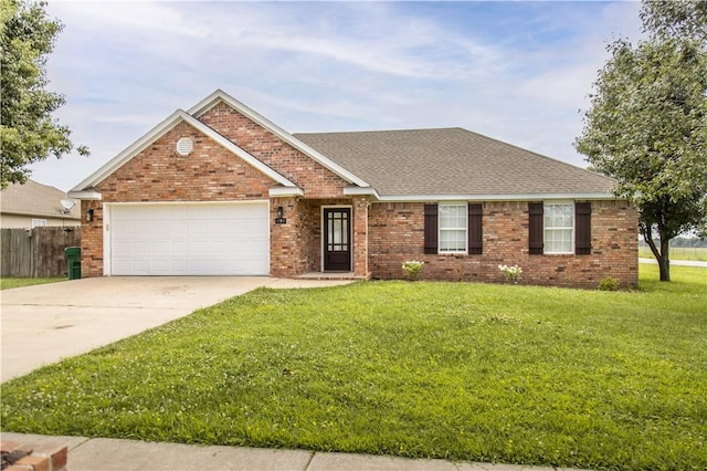 single story home featuring brick siding, a garage, concrete driveway, and a front yard