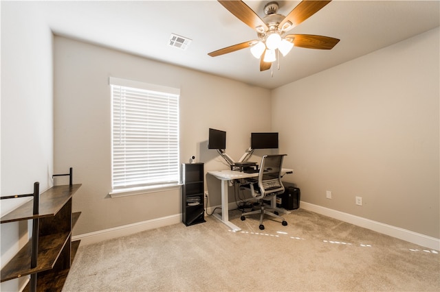 office with visible vents, baseboards, carpet, and a ceiling fan