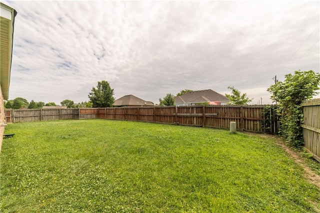 view of yard featuring a fenced backyard