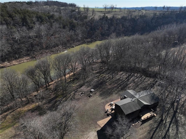 birds eye view of property with a forest view