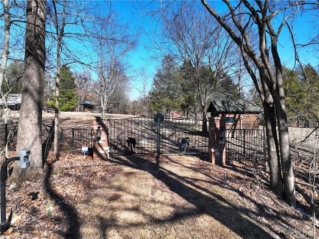 exterior space featuring fence and a gate