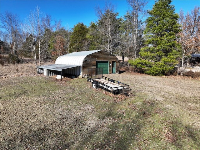 view of pole building featuring driveway