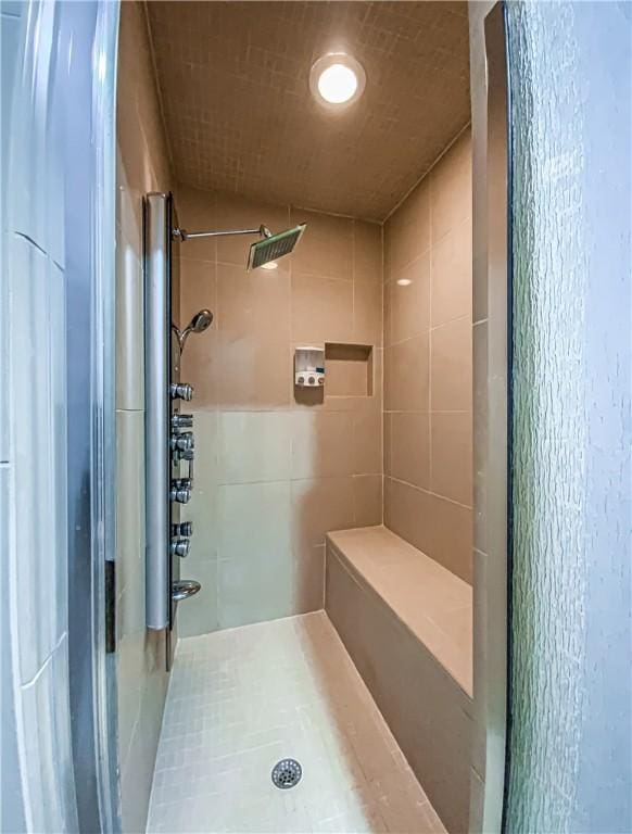 full bath with a shower stall