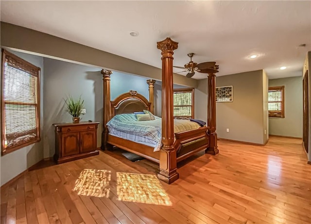 bedroom with ornate columns, recessed lighting, baseboards, and light wood-style floors