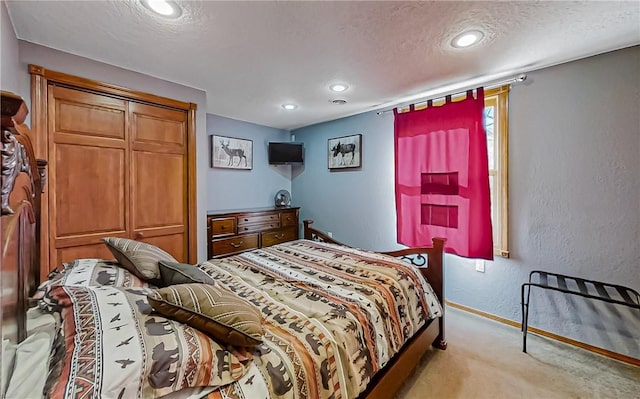 bedroom featuring a textured ceiling, recessed lighting, baseboards, light colored carpet, and a textured wall