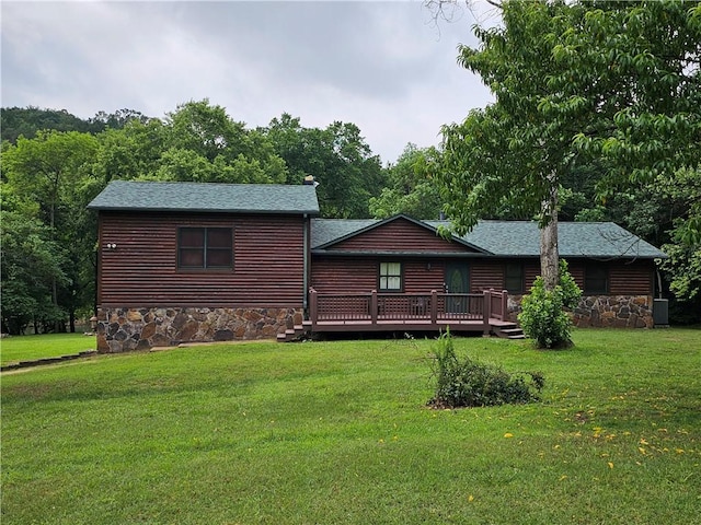 725 County Road 455, Berryville, AR 72616 - rear view of property featuring stone siding, a wooden deck, and a yard