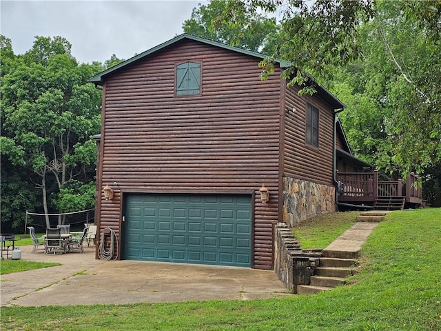 725 County Road 455, Berryville, AR 72616 - view of home's exterior featuring a garage, log veneer siding, a wooden deck, and a yard