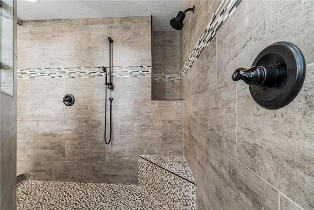 bathroom with tiled shower