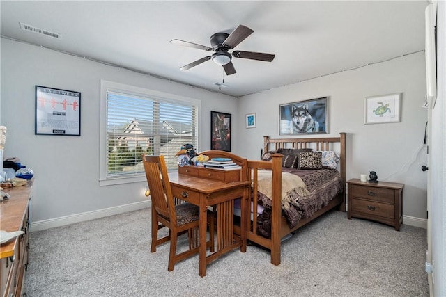 bedroom with visible vents, light carpet, baseboards, and ceiling fan