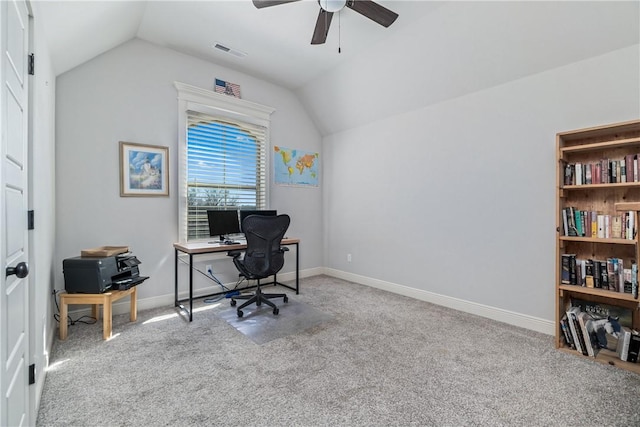 carpeted office space with visible vents, ceiling fan, baseboards, and lofted ceiling