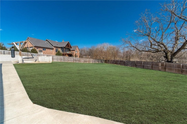 view of yard featuring a fenced backyard