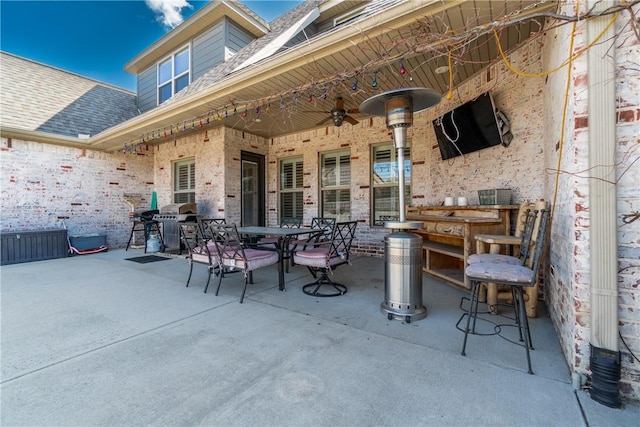 view of patio / terrace with outdoor dining area and a ceiling fan