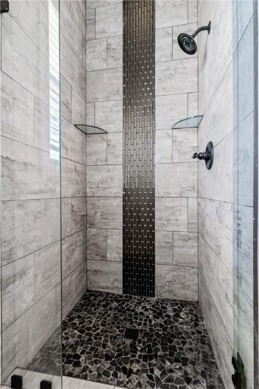 bathroom with a shower stall