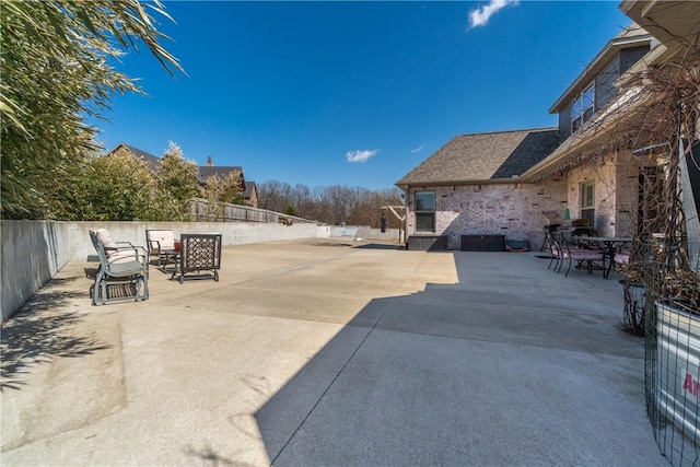 view of patio / terrace with outdoor dining area and fence