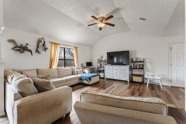 living area with a ceiling fan, wood finished floors, visible vents, lofted ceiling, and a textured ceiling