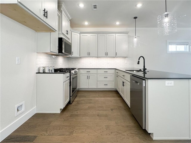 4412 W Bronco Dr, Fayetteville, AR 72704 - kitchen featuring appliances with stainless steel finishes, a peninsula, decorative backsplash, white cabinetry, and crown molding