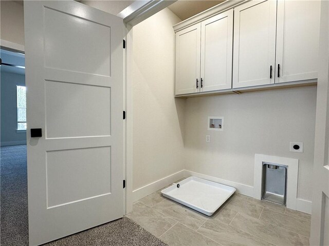 4412 W Bronco Dr, Fayetteville, AR 72704 - laundry area with hookup for a washing machine, cabinet space, and electric dryer hookup
