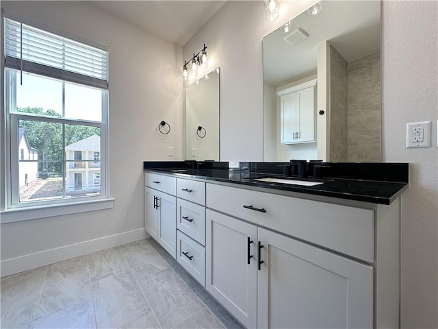 4412 W Bronco Dr, Fayetteville, AR 72704 - bathroom with double vanity and marble finish flooring