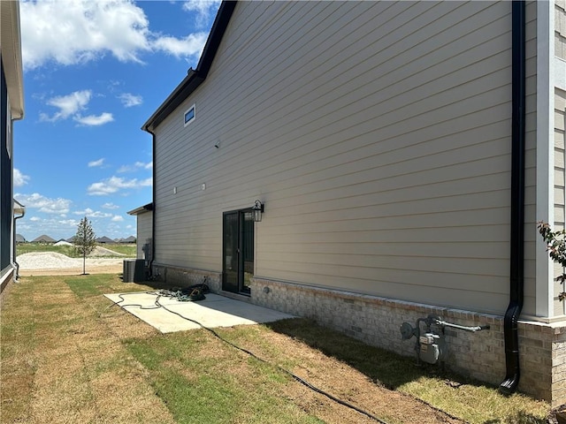 4412 W Bronco Dr, Fayetteville, AR 72704 - view of side of property featuring a patio area and a yard