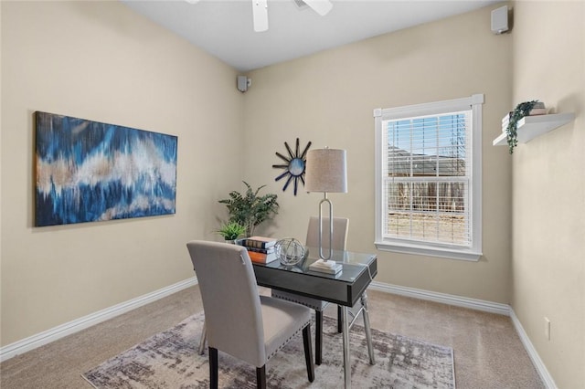 office space with baseboards, a ceiling fan, and carpet flooring