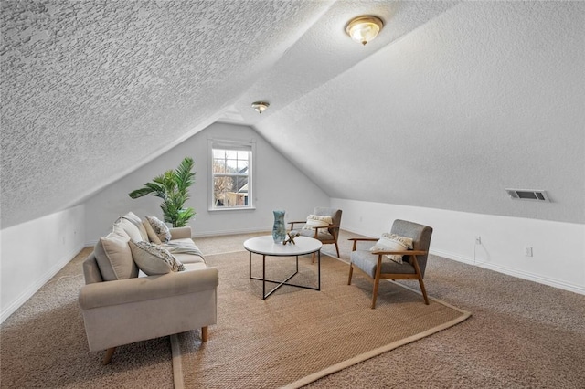 living area with lofted ceiling, carpet flooring, and baseboards