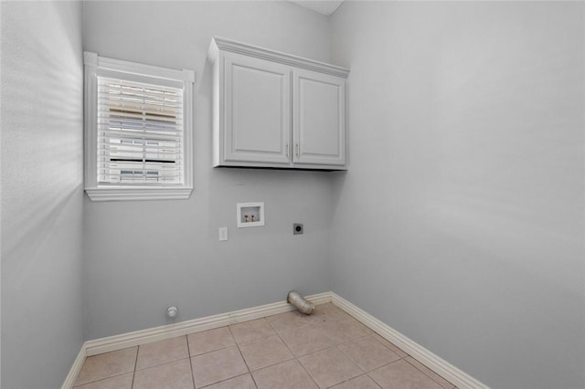 washroom featuring light tile patterned floors, hookup for a washing machine, hookup for an electric dryer, and baseboards