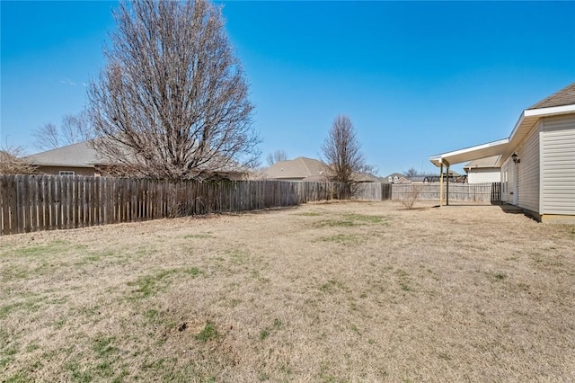 view of yard with a fenced backyard