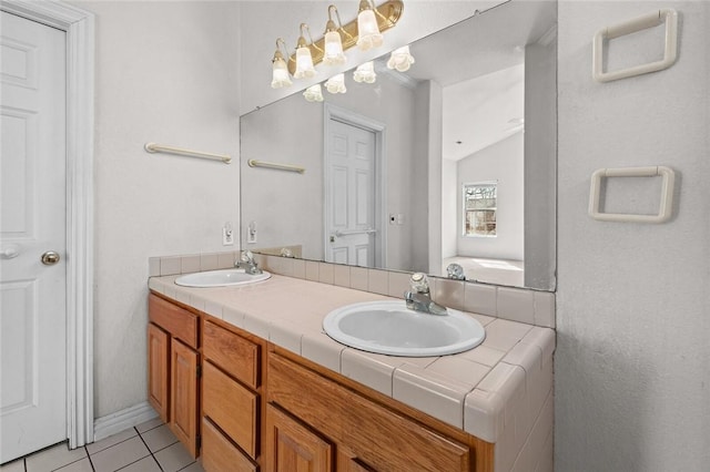 full bath featuring tile patterned flooring, double vanity, and a sink