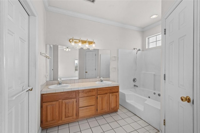 bathroom with tile patterned floors, ornamental molding,  shower combination, and a sink