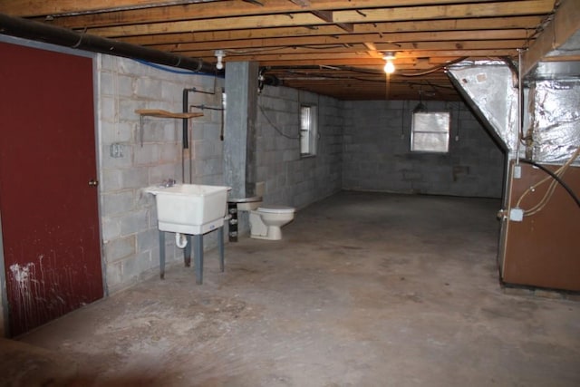 basement featuring heating unit