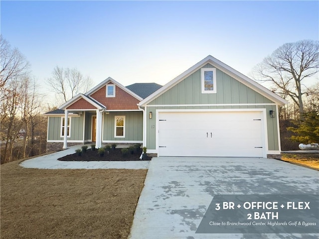 craftsman house with a garage, board and batten siding, and driveway