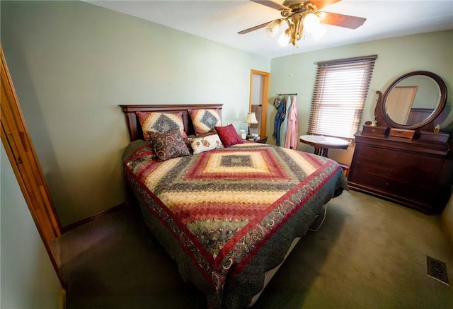 carpeted bedroom with visible vents, baseboards, and ceiling fan