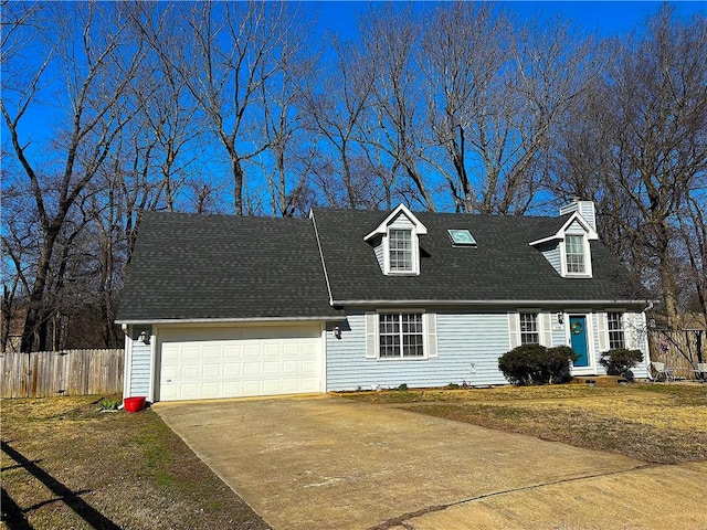 cape cod-style house featuring concrete driveway, an attached garage, fence, and a shingled roof