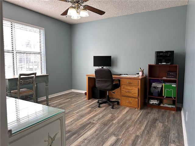 office space with baseboards, a textured ceiling, ceiling fan, and wood finished floors