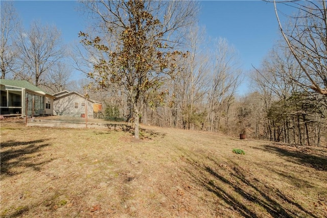 view of yard with a sunroom