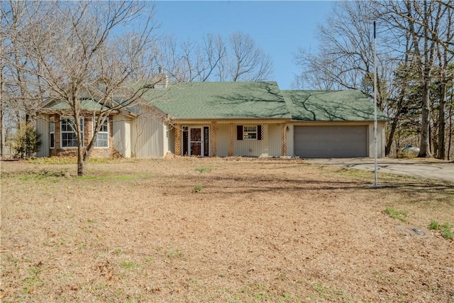 ranch-style house with a garage and concrete driveway