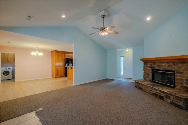 unfurnished living room with visible vents, high vaulted ceiling, washer / dryer, ceiling fan with notable chandelier, and light colored carpet