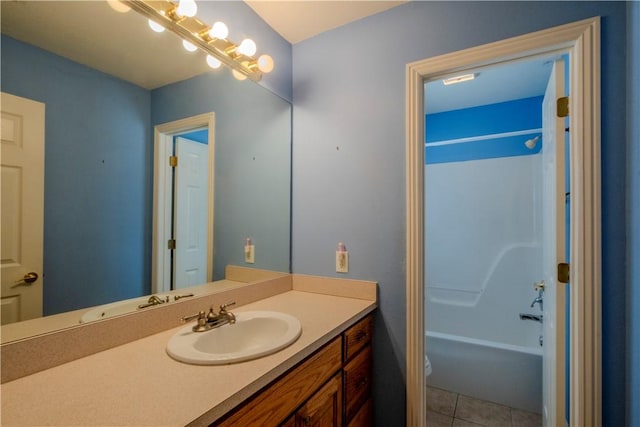 bathroom featuring tile patterned flooring, toilet, vanity, and shower / bathtub combination