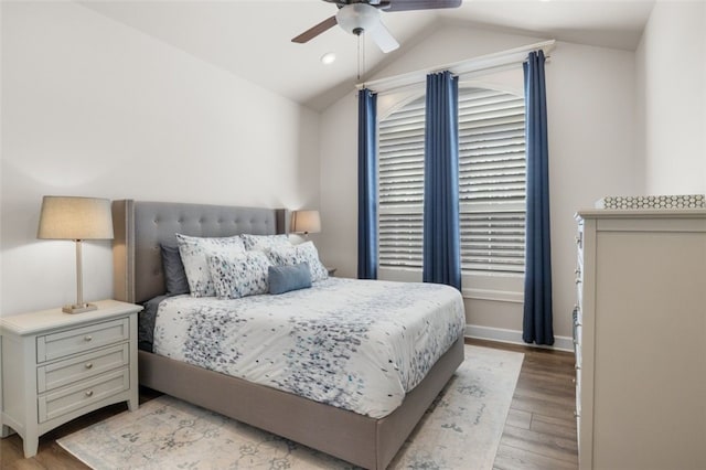 bedroom featuring recessed lighting, light wood finished floors, baseboards, ceiling fan, and vaulted ceiling