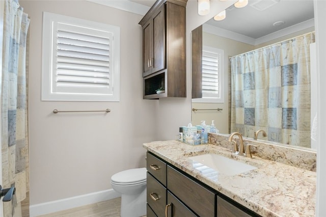 bathroom with vanity, a shower with shower curtain, baseboards, ornamental molding, and toilet