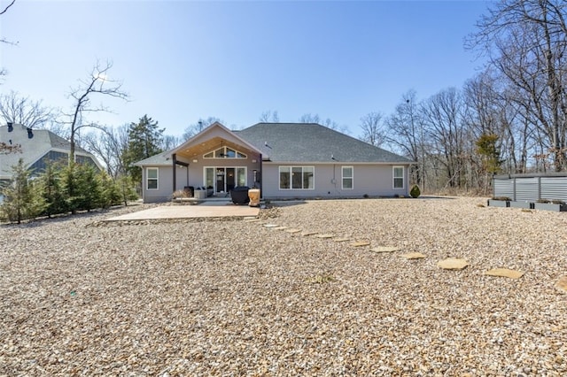 back of property featuring a patio area