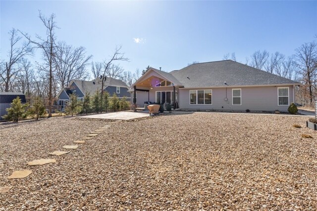 back of house with a patio and fence