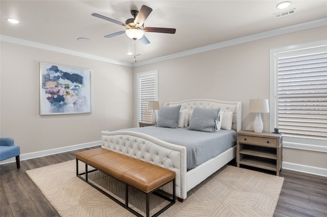 bedroom with visible vents, baseboards, and crown molding