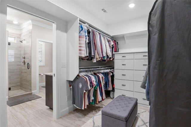 walk in closet with visible vents and light wood-style floors