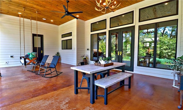 view of patio / terrace with a ceiling fan, outdoor dining area, and french doors