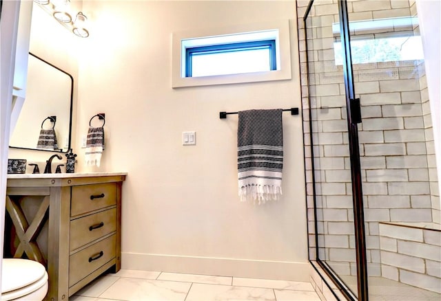 full bath with vanity, a shower stall, baseboards, and marble finish floor