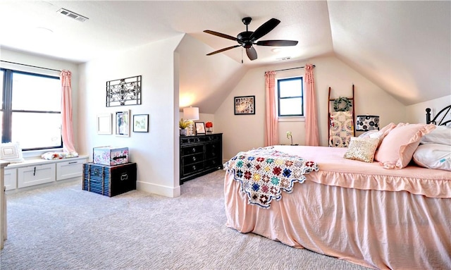 bedroom with visible vents, a ceiling fan, baseboards, lofted ceiling, and light colored carpet