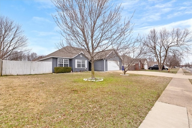 ranch-style house featuring an attached garage, concrete driveway, a front yard, and fence