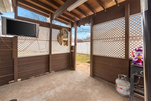 view of patio featuring fence