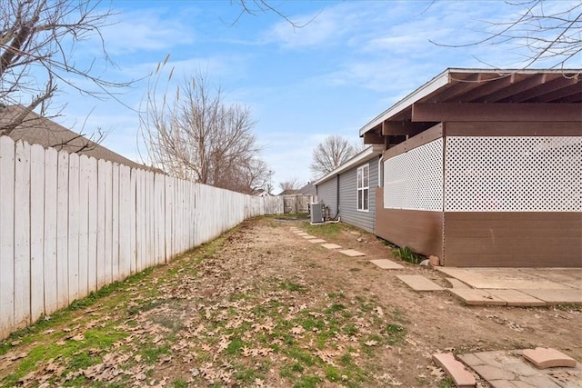 view of yard featuring cooling unit and a fenced backyard